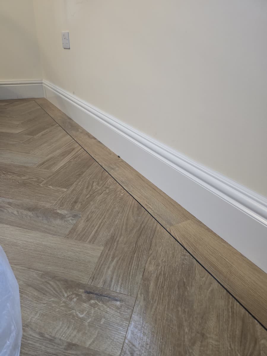 ThermaSkirt over grey herringbone flooring